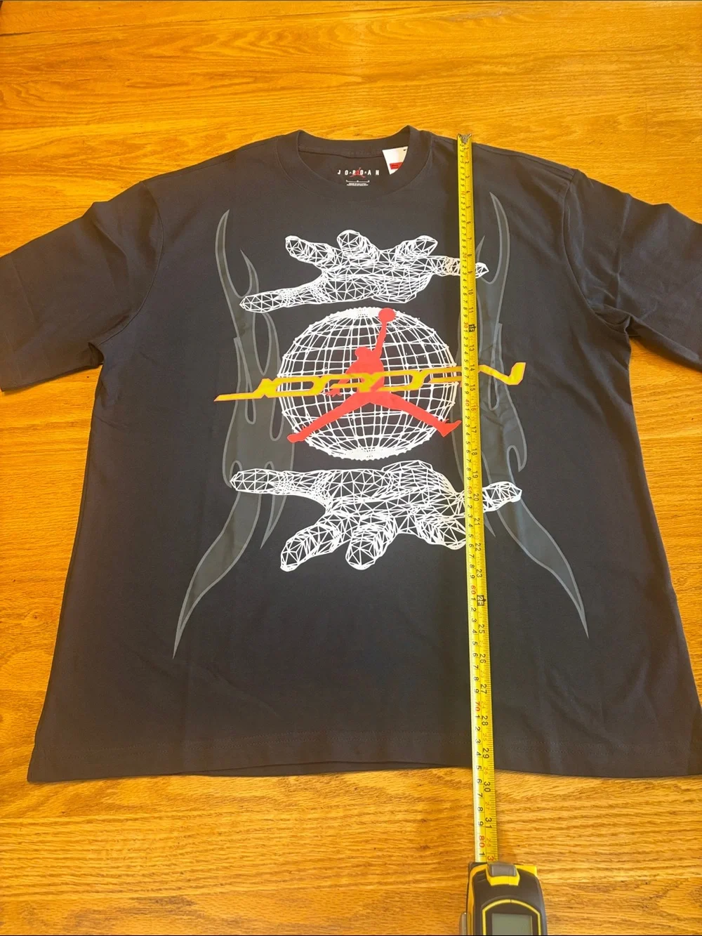 Jordan Black Short-Sleeve Graphic Tee with Red and Yellow Logo